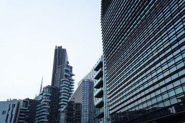 Naklejka premium modern buildings in european futuristic city in italy in cosmopolitan blue and gray colors