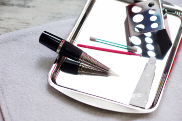 Closeup of permanent makeup tattooing machine