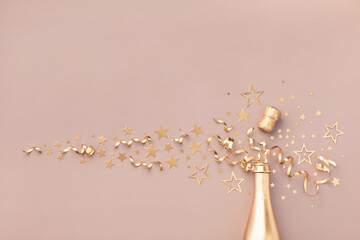 Fashion background with golden champagne bottle, confetti stars, holiday decoration and party...