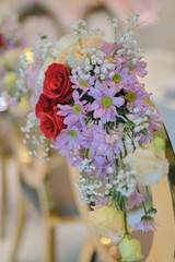 New wedding decoration with multi floral concept indoors. Wedding Ceremony, or wedding receptions. Family intimacy wedding dinner. 