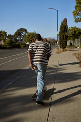 Portrait of young non-binary on skateboard   © Sheilby Macena
