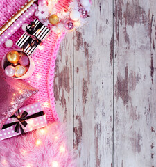 Christmas flat lay background in pink and gold colors with plaid