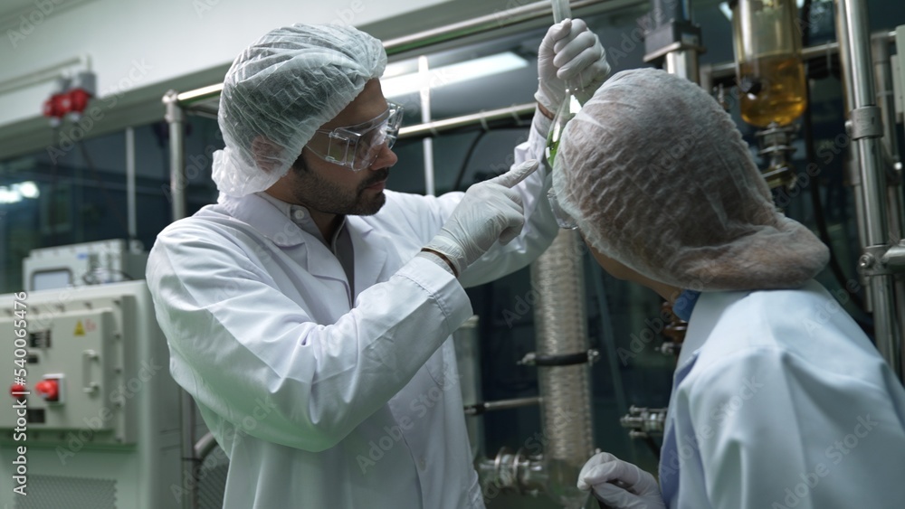 Poster two scientist in professional uniform working in laboratory for chemical and biomedical experiment