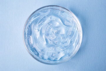 Top view of cosmetics gel with bubbly structure in the petri dish.Cosmetics banner with copy space.