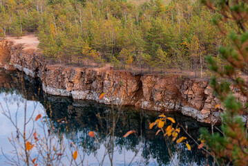 landscape of old stone pit with azure blue water