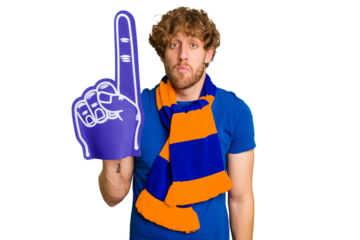 Young caucasian sports fan man isolated on white background shrugs shoulders and open eyes confused.