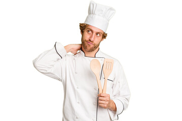 Young cook man isolated on white background touching back of head, thinking and making a choice.