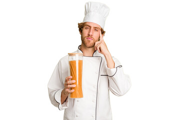 Young cook man isolated on white background pointing temple with finger, thinking, focused on a task.