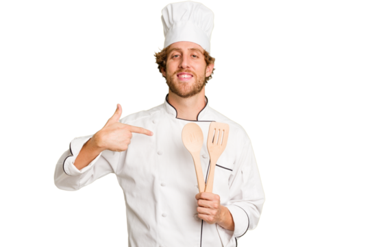 Young cook man isolated on white background person pointing by hand to a shirt copy space, proud and confident
