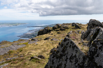 Rocky mountain, bay, river and sea in the background.