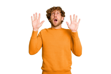 Young caucasian man isolated on green chroma background screaming to the sky, looking up, frustrated.