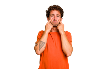 Young caucasian curly hair man isolated Young caucasian man with curly hair isolated crying, unhappy with something, agony and confusion concept.