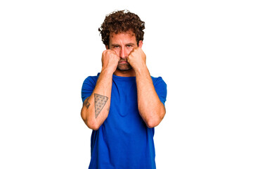 Young caucasian curly hair man isolated Young caucasian man with curly hair isolated throwing a punch, anger, fighting due to an argument, boxing.