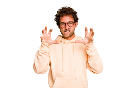 Young caucasian curly hair man isolated Young caucasian man with curly hair isolated showing claws imitating a cat, aggressive gesture.