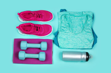  clothes and equipment for jogging and fitness on teal color background