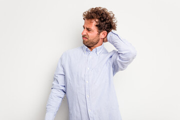 Fototapeta premium Young caucasian curly hair man isolated on white background tired and very sleepy keeping hand on head.