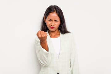 Young business Indian woman isolated on white background showing fist to camera, aggressive facial expression.