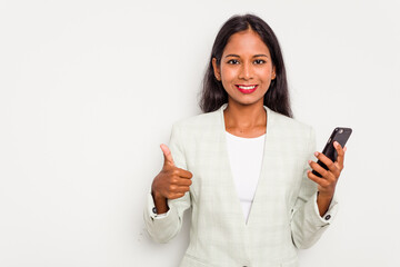 Young business Indian woman holding a mobile phone isolated on white background smiling and raising thumb up