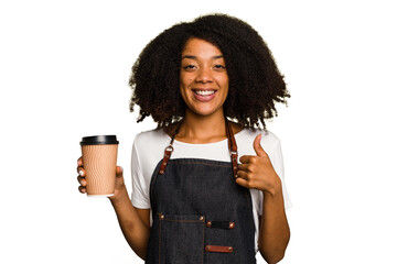 Young african american woman barista holding a takeaway coffee smiling and raising thumb up