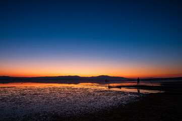 Sunrise by the lake and transition from blue to orange