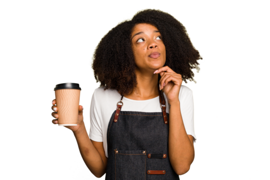 Young african american woman barista holding a takeaway coffee looking sideways with doubtful and skeptical expression.