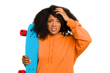 Young skater African American woman holding a little skate isolated being shocked, she has remembered important meeting.