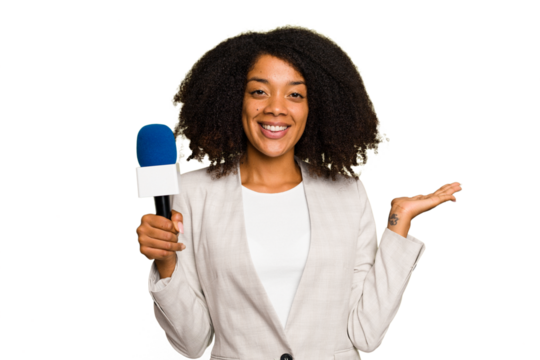 Young TV presenter African American woman with a microphone isolated showing a copy space on a palm and holding another hand on waist.