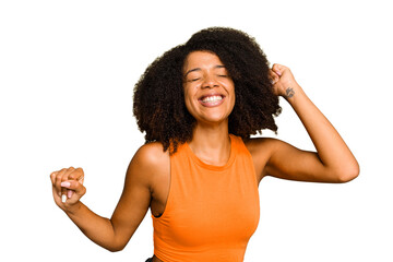 Young African American woman isolated dancing and having fun.