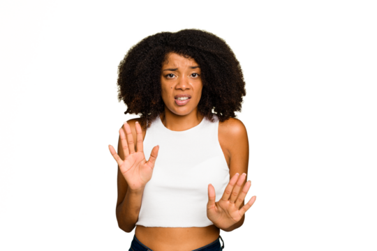 Young African American woman isolated rejecting someone showing a gesture of disgust.