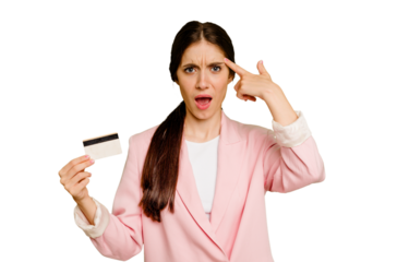 Business caucasian woman holding a credit card isolated showing a disappointment gesture with forefinger.