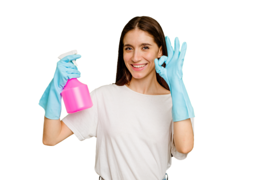Young cleaner woman isolated cheerful and confident showing ok gesture.