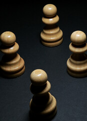 Fototapeta na wymiar chess pieces on a black background