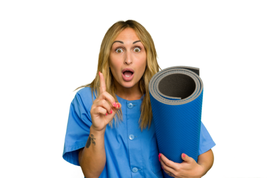 Young caucasian physiotherapist woman holding a mat isolated on green chroma background having an idea, inspiration concept.