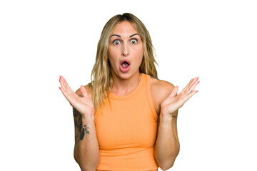 Fototapeta premium Young caucasian woman isolated on green chroma background surprised and shocked.