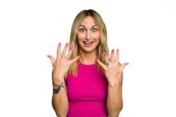 Young caucasian woman isolated on green chroma background showing number ten with hands.