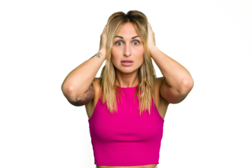 Young caucasian woman isolated on green chroma background covering ears with hands trying not to hear too loud sound.