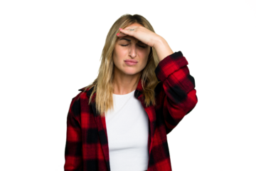 Young caucasian woman isolated on green chroma background touching temples and having headache.