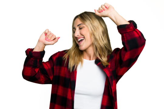 Young caucasian woman isolated on green chroma background celebrating a special day, jumps and raise arms with energy.