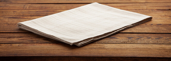 Empty canvas napkin on wooden desk top view