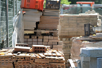 materials for construction and maintenance of buildings in a construction site warehouse