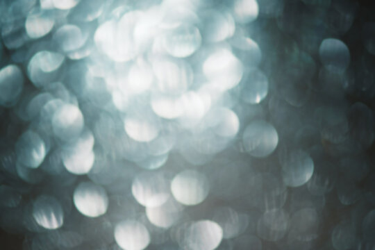 Defocus Light Blue Sparkles. Glitter As A Blurred Background.