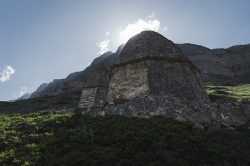 ancient crypts and burials in cemetery in mountain village in Caucasus