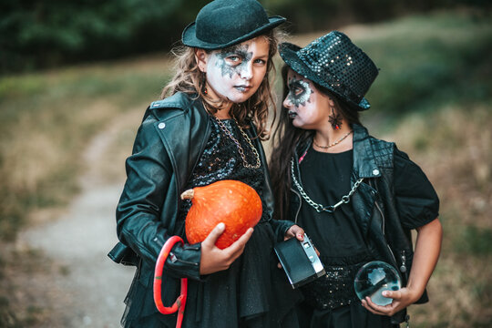 Teenage girls in hard rock costumes celebrate Halloween party