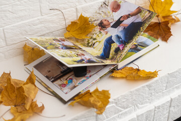 dry autumn leaves and a photo album