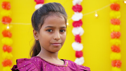 Little Indian girl with lord ganesha , Celebrating Ganesh Festival or Diwali Festival