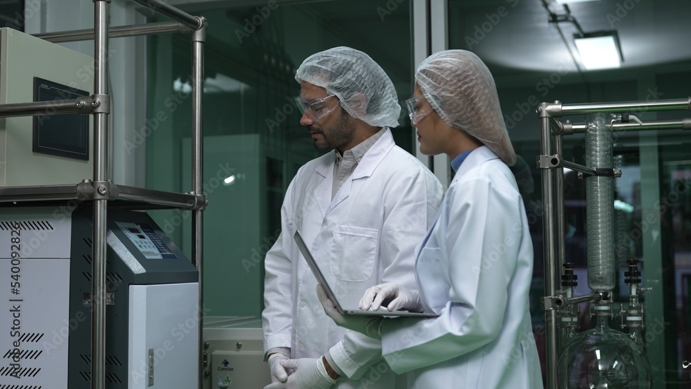 Poster two scientist in professional uniform working in laboratory for chemical and biomedical experiment