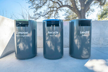 Black trash cans for segregation of wastes at Waterloo Park in Austin Texas