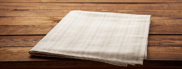 Empty canvas napkin on wooden desk top view