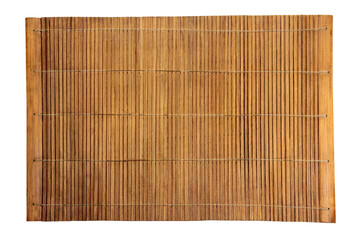 Brown bamboo food mat on wooden table.