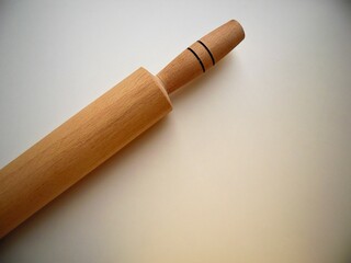rolling pin for dough on a light background, close-up
